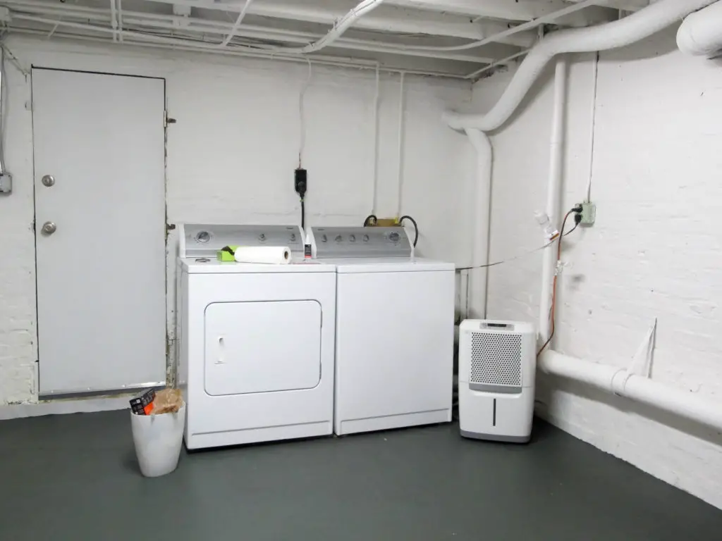 Painted basement laundry room floors and floor joists | EffieRow.com