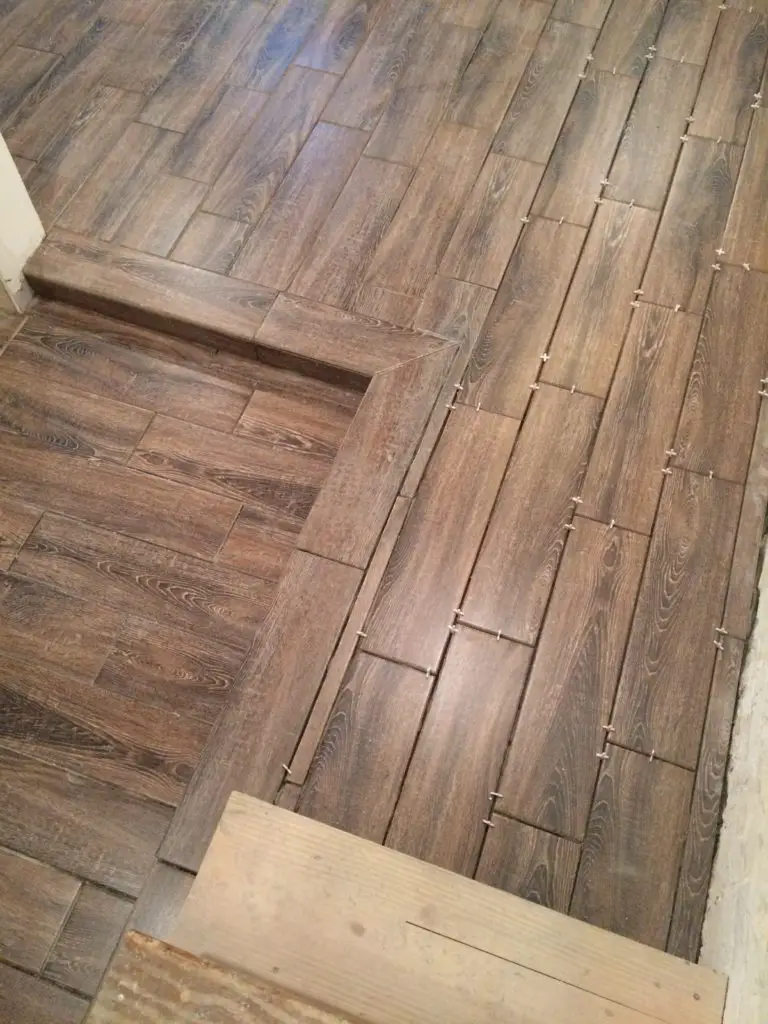 Faux wood ceramic tiles in a basement renovation. Great waterproof option that looks amazing. | EffieRow.com

#fauxwoodtiles #ceramicwoodtile #basementfloor #basementflooringoptions #basementtilefloor #basementwoodfloor