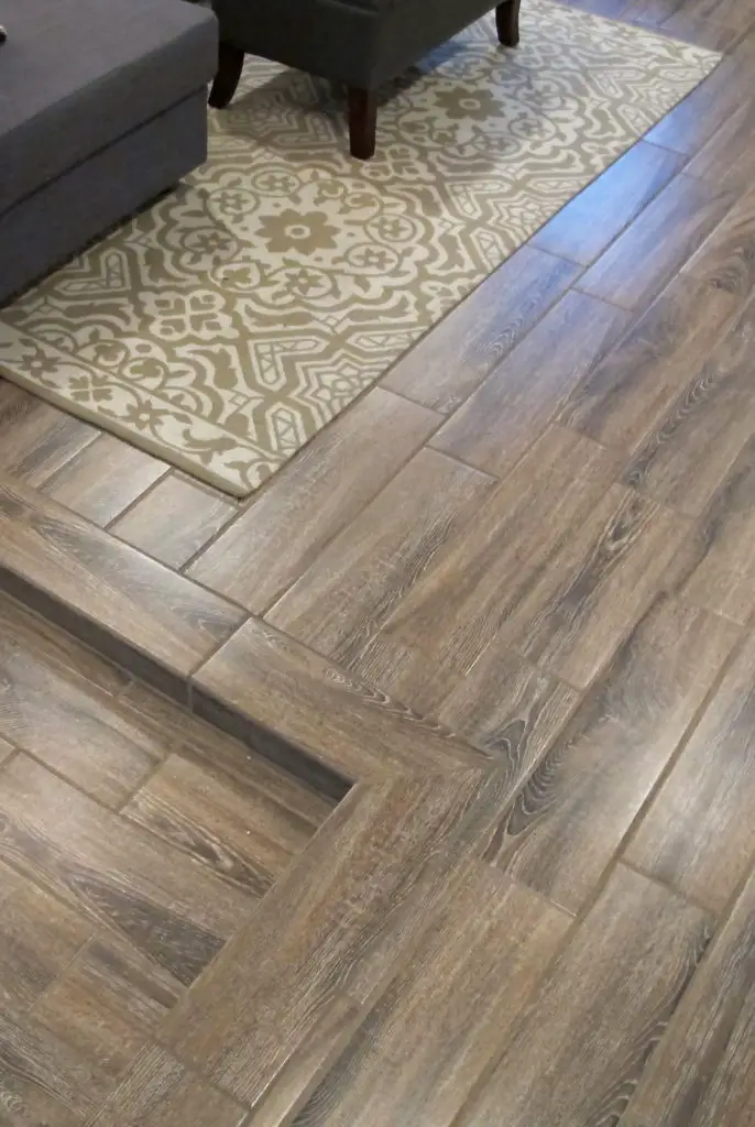 Faux wood tiles in a row home basement renovation - such a gorgeous transformation! | EffieRow.com