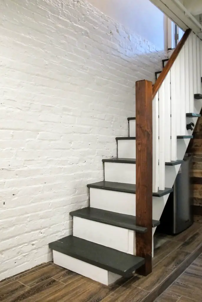 Painted and upgrade basement stairs on a budget. Full basement remodel in a Baltimore row home . | EffieRow.com