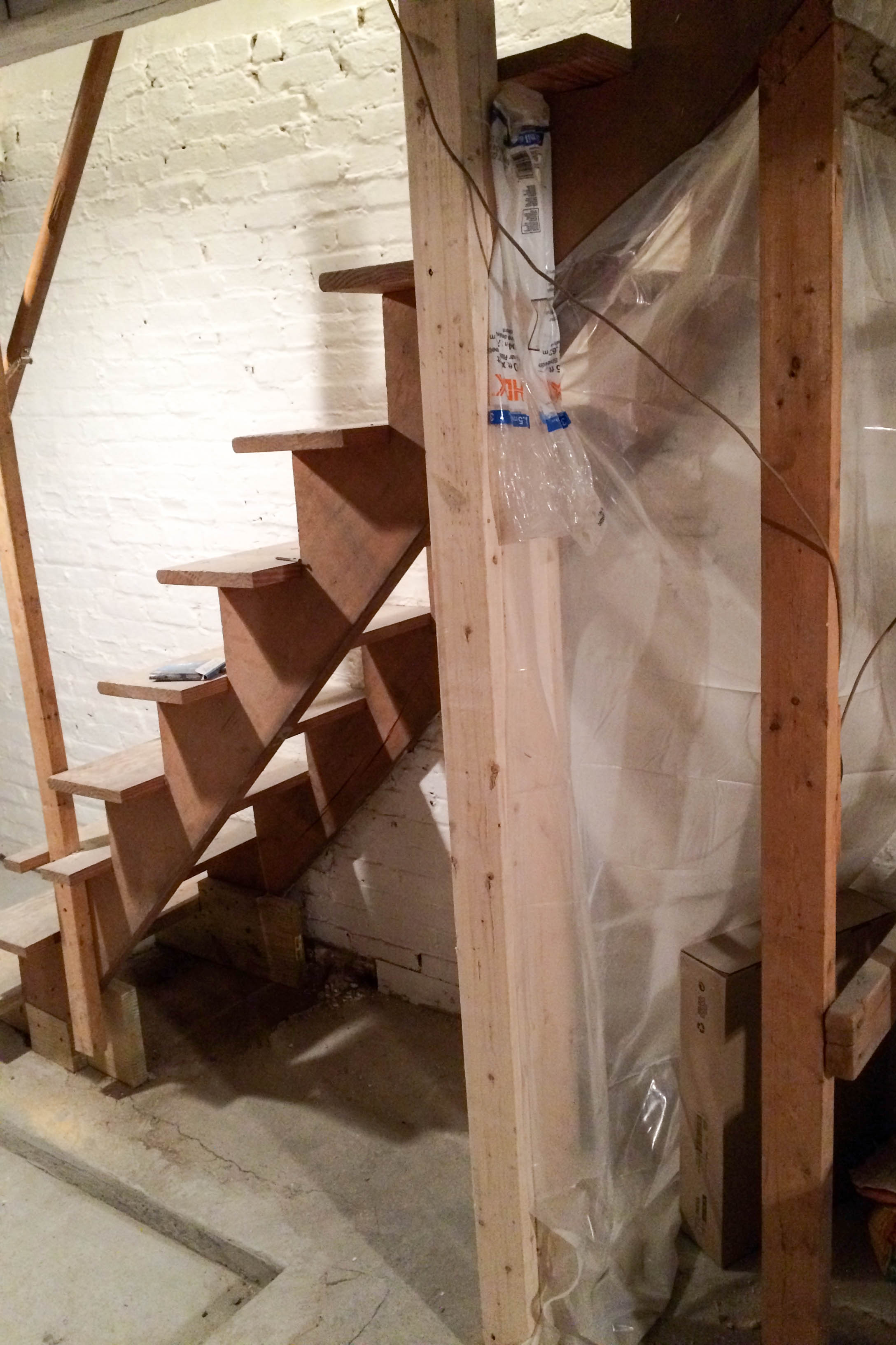 Upgrading basement stairs with paint and plywood - no need to rip them out!