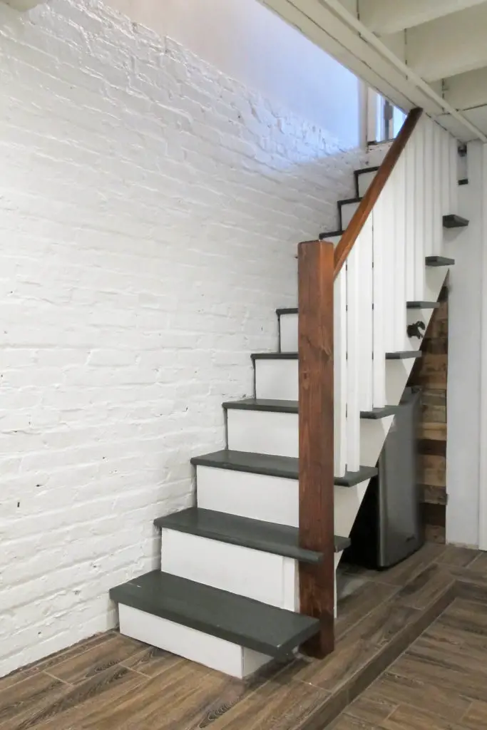 Upgraded basement stairs with paint and plywood - no need to rip them out!