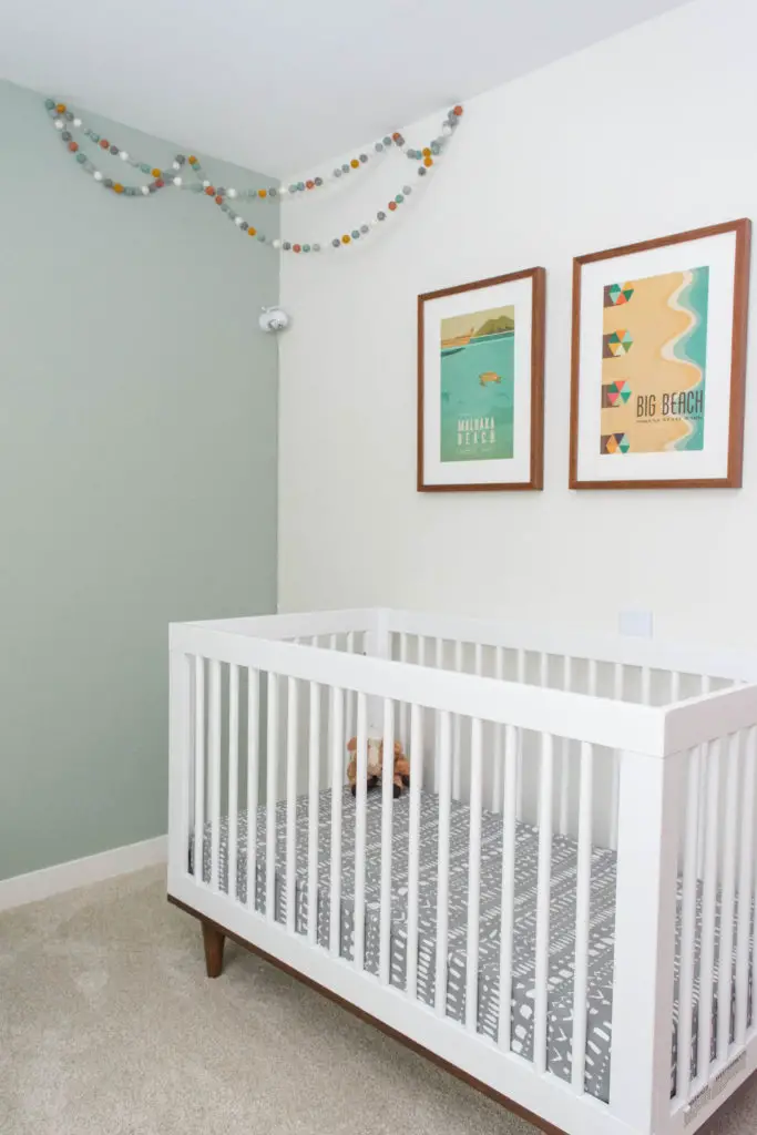 Maui-themed nursery with Baby Mod crib and a matching Ikea Kallax changing table. Love the modern and colorful accents!