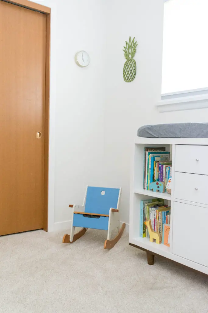 Gender neutral nursery in a mid century home. This is what leaving oak doors unpainted look like - adding new trim makes a big difference! Trim is BM Simply White and the walls are BM White Dove.