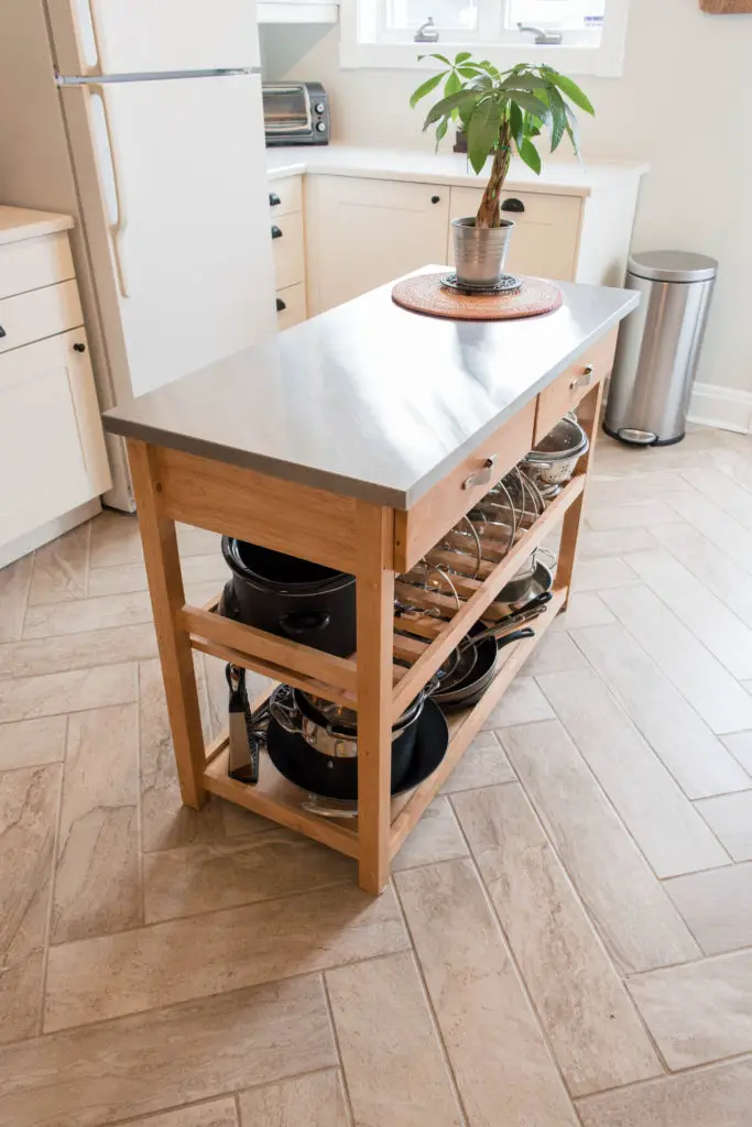 Kitchen island cart for extra storage and counter space. Also loving the herringbone tile floors. |  From EffieEow.com