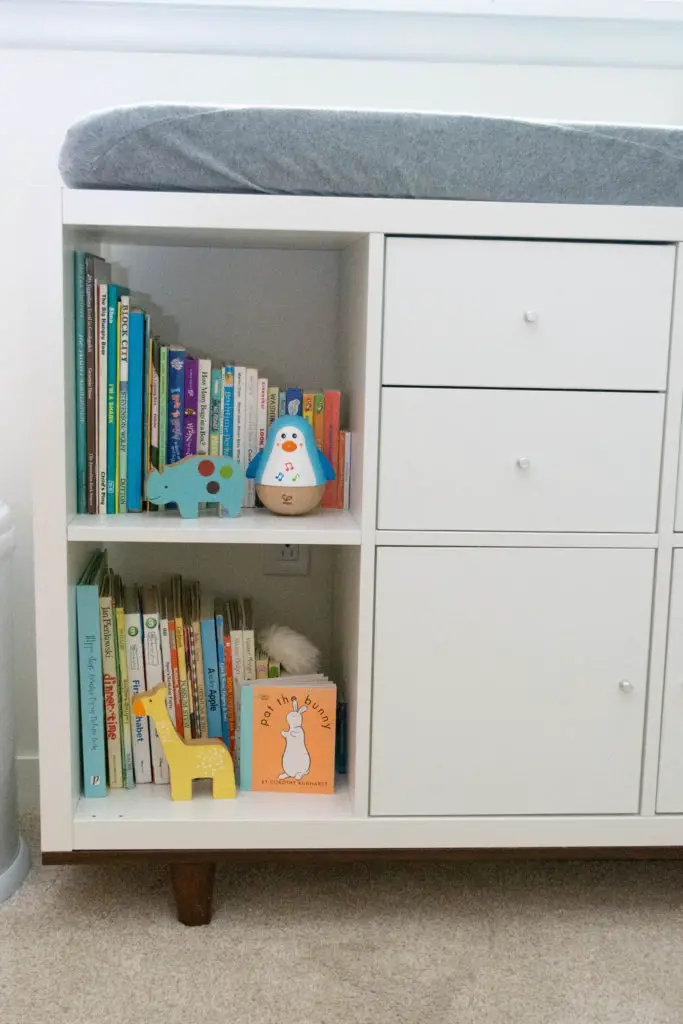 Custom Ikea Kallax changing table with tapered legs.