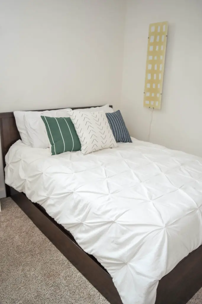 Simple guest room on a budget. Bed has storage underneath for extra linens. 