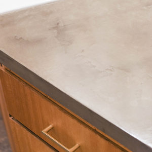 Ardex feather finish with an added ingredient to improve longevity of faux concrete counters.