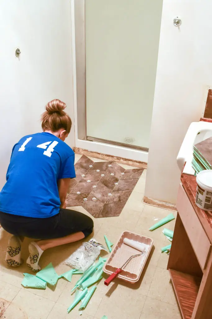 How to lay custom vinyl tile floors - great option for a bathroom renovation and easy way to cover up existing floors!