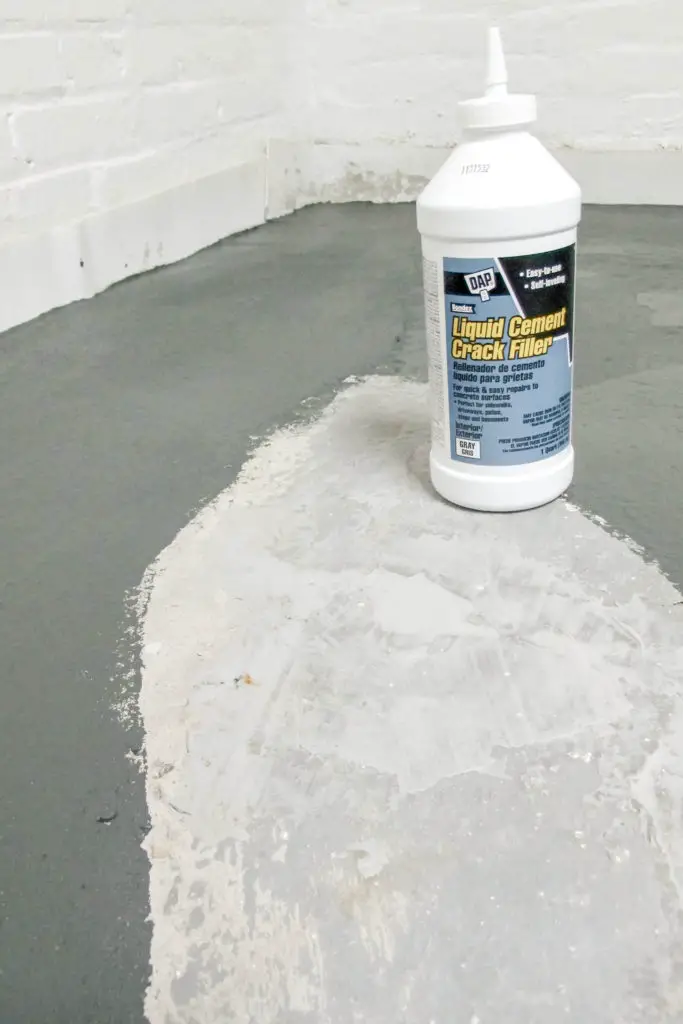 Prepping old concrete basement floors for paint.