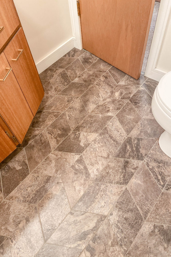 DIY custom-cut vinyl tiles with grout. Great option for a small bathroom. | EffieRow.com
