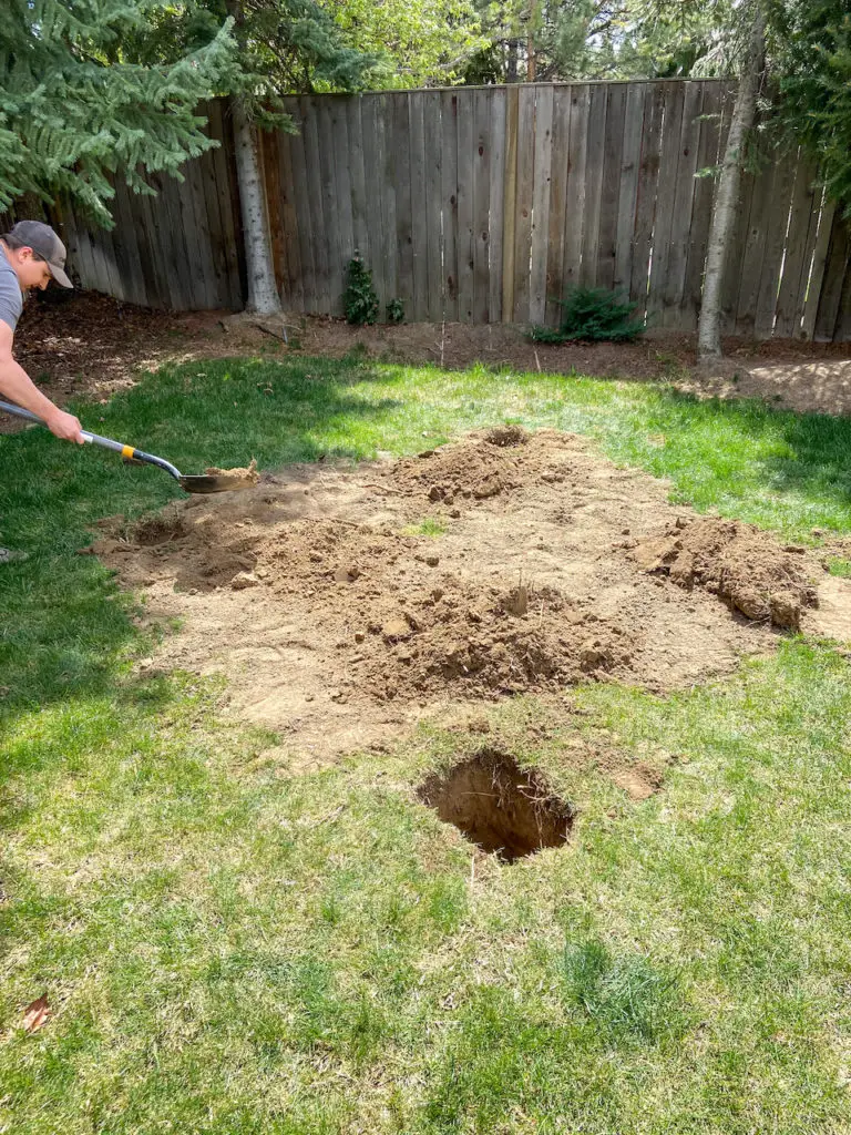 Digging holes for a playhouse deck install. 